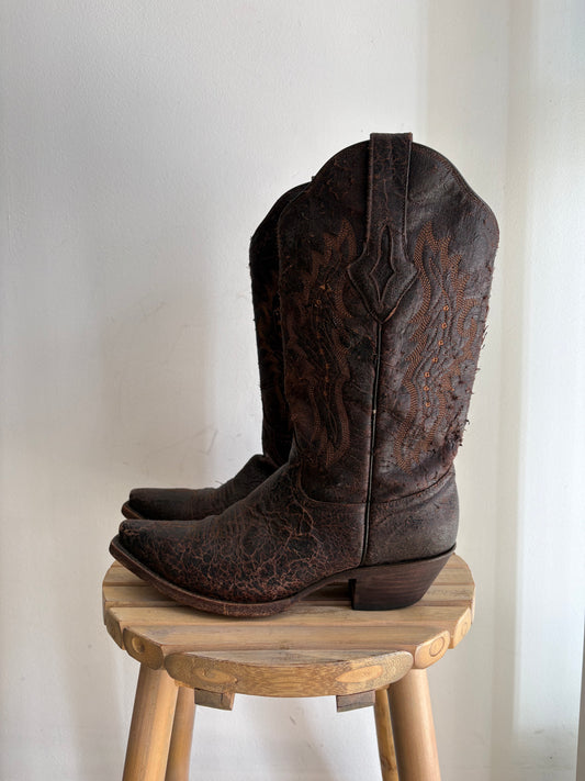 Worn brown western boots