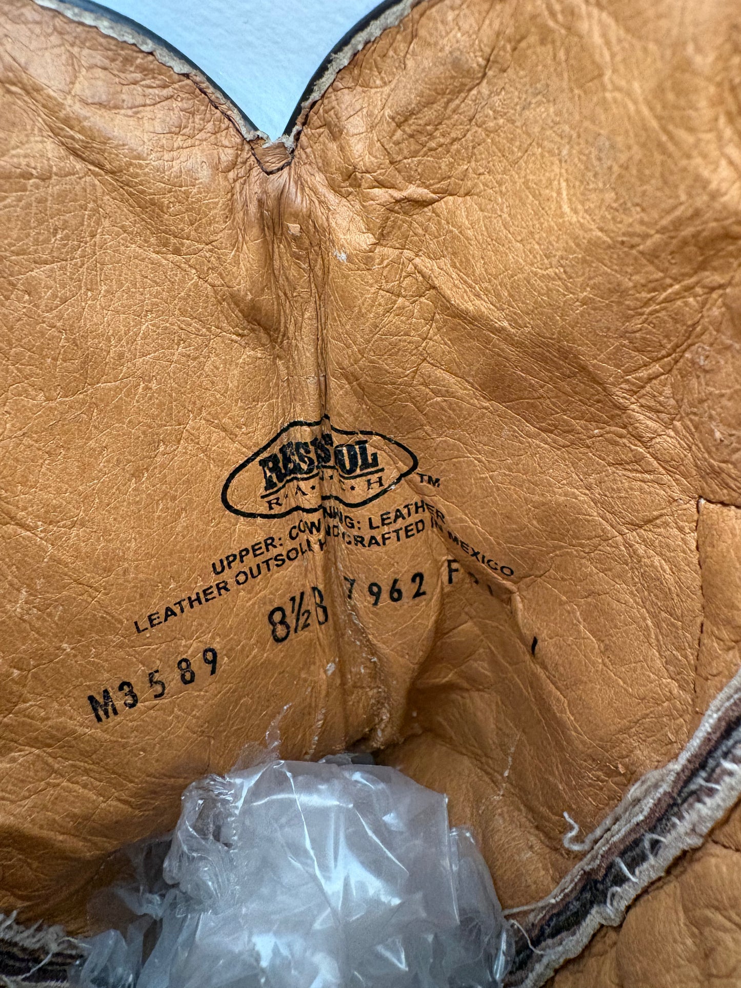 Worn brown western boots