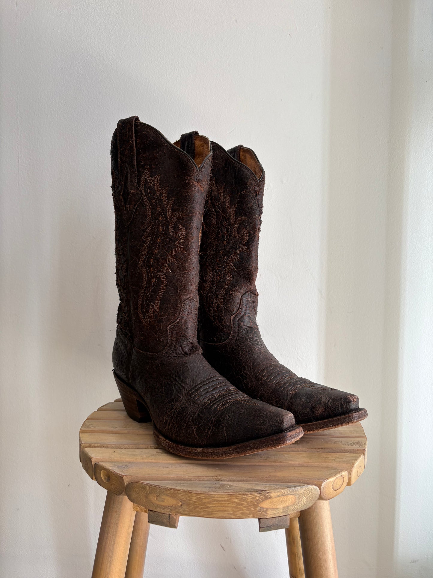 Worn brown western boots