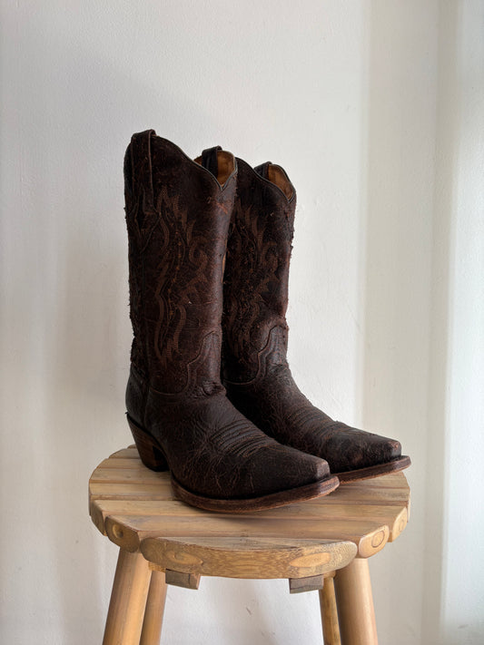 Worn brown western boots