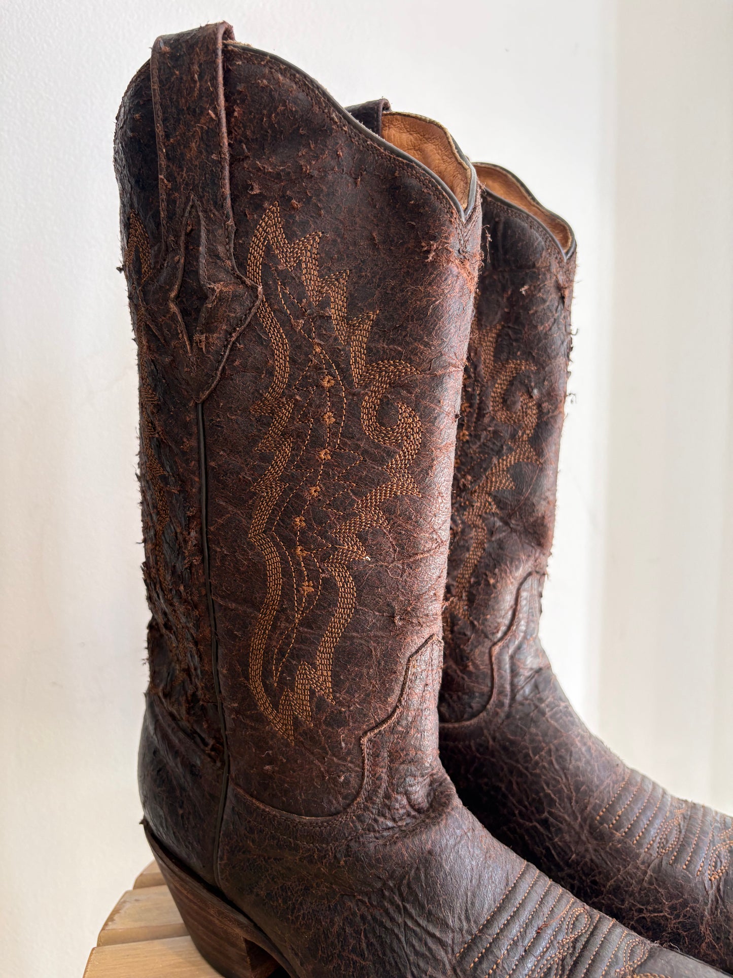 Worn brown western boots