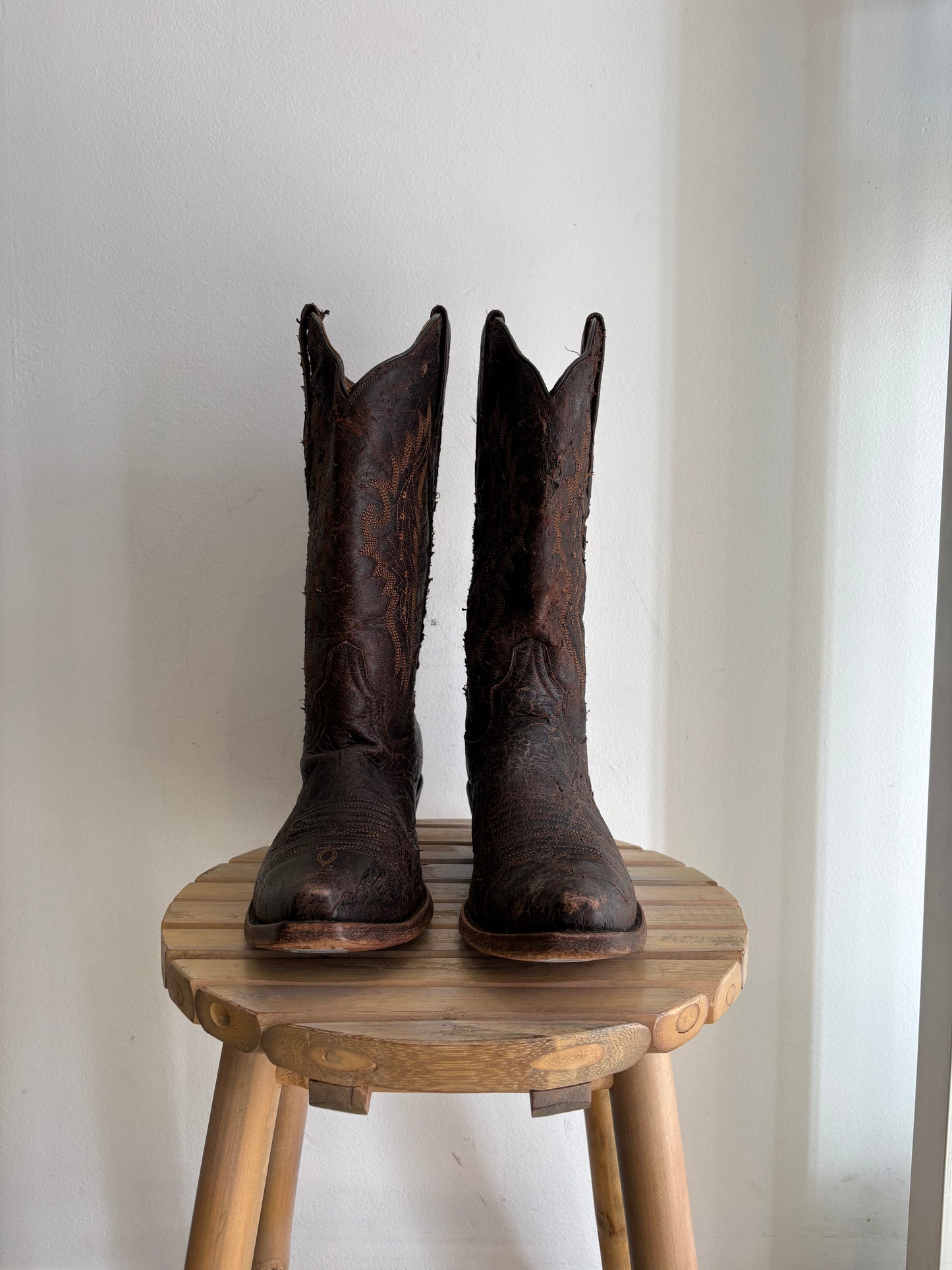 Worn brown western boots