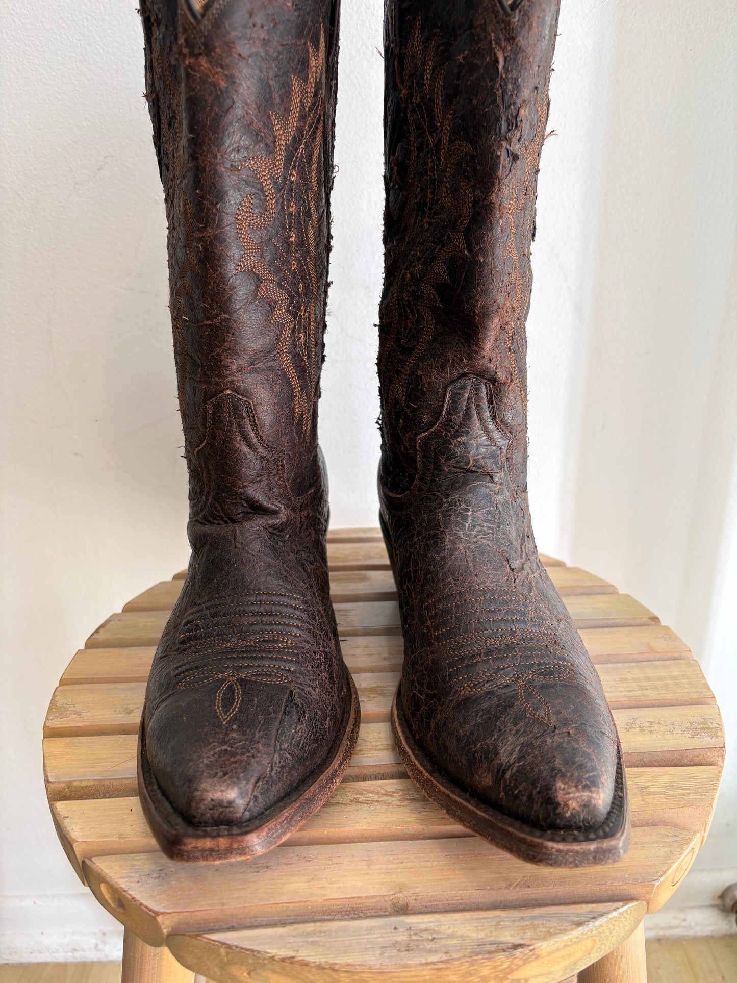 Worn brown western boots