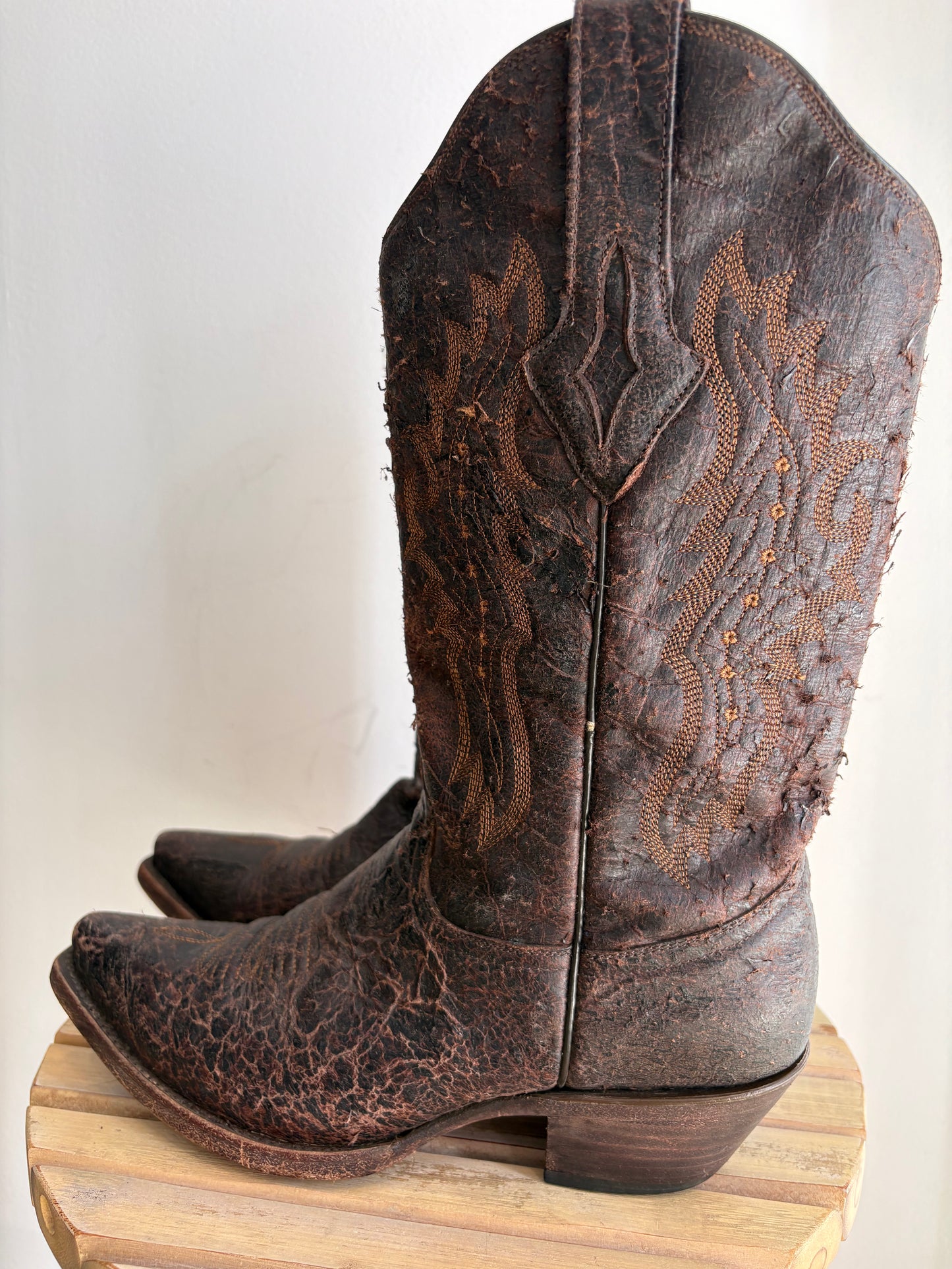 Worn brown western boots